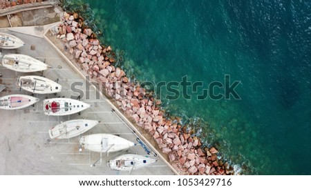 Aerial drone photo of tropical clear water port with small yachts docked