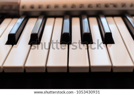 Piano keys toned,close-up photo. Front view. Electronic synthesizer