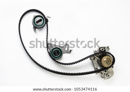 Kit of timing belt with rollers on a white background isolated. Auto Parts. Spare parts for the repair of cars. Royalty-Free Stock Photo #1053474116