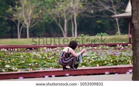 The girl is photographed in a park, Thailand.