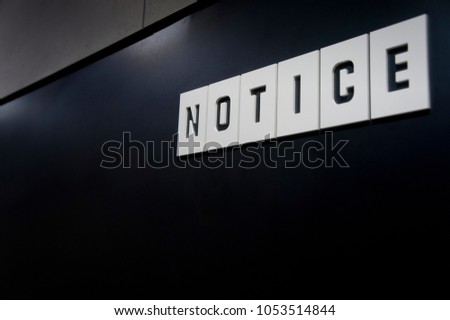 Notice sign on wall