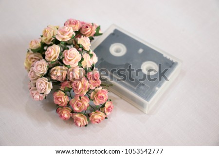 Colorful mulberry paper flowers with vintage tape placed on white silk for background,White backdrop.