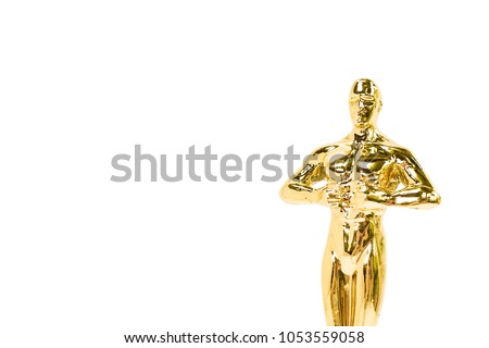 Oscars golden award or trophy isolated on a white background. Success and victory concept. Copy space on the left area for your text.