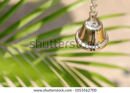Golden bell and Palm leaves background