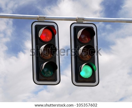 Red and green traffic lights against blue sky backgrounds Royalty-Free Stock Photo #105357602