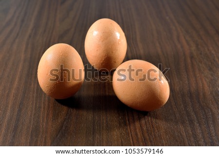 Close up of egg isolated on wooden table with copy space. selective focus.