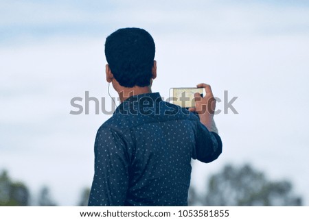 Man taking selfie with a cellphone unique stock photograph