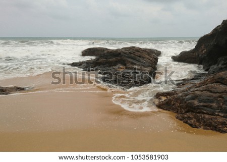 An Image of Wave And Rock. Rocks with wave from sea and some images are similar but different shutter speeds. Long exposure( photography)  