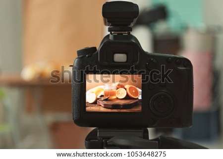 Professional camera on tripod in studio, closeup. Food photography