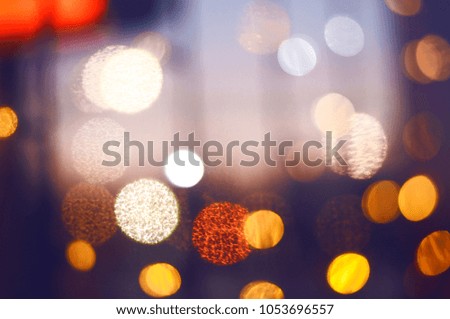  View of city night lights blurred bokeh background. Defocused cityscape at night light background.