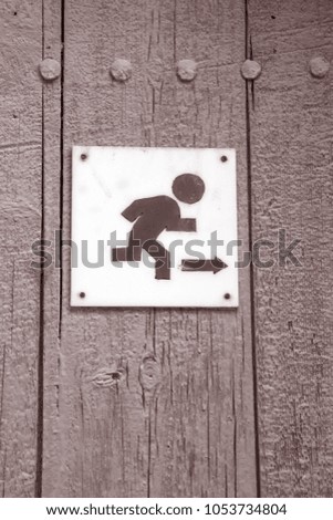 Escape Sign on Door in Black and White Sepia Tone
