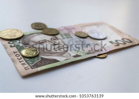 Ukrainian hryvnia. Ukrainian money. Banknote with coins. Closeup photo.
