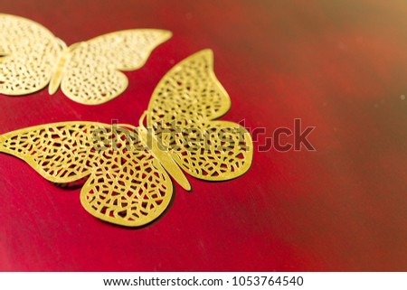 gold carved butterflies, decorative butterfly on red background