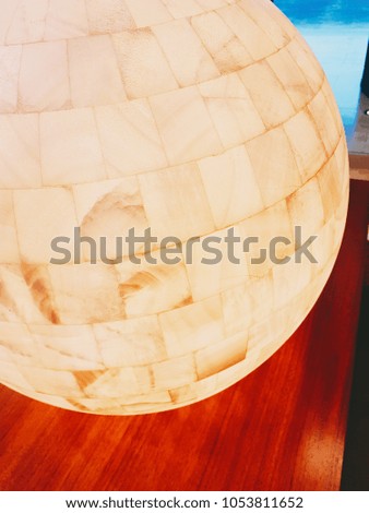 Ball of light on a wooden table.