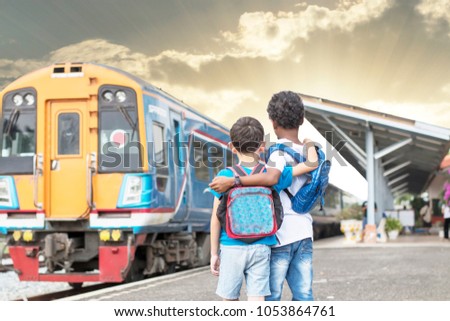 two best friends waiting for trains to travelling,  child travelling concept