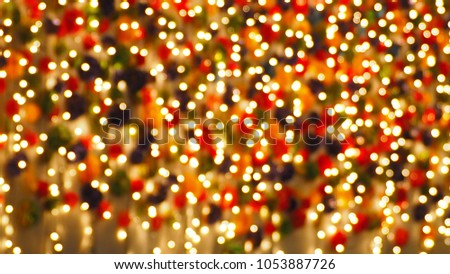 Colorful bokeh warm lights for background. Lighting and party concept.