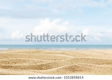 close up sand of beach on blur beautiful sky background, summer concept Royalty-Free Stock Photo #1053898814