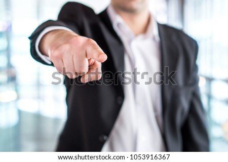 Boss giving order or firing employee. Powerful business man pointing camera with finger. Angry executive or manager. Tough leadership, strict discipline, workplace bullying or fight at work. Royalty-Free Stock Photo #1053916367