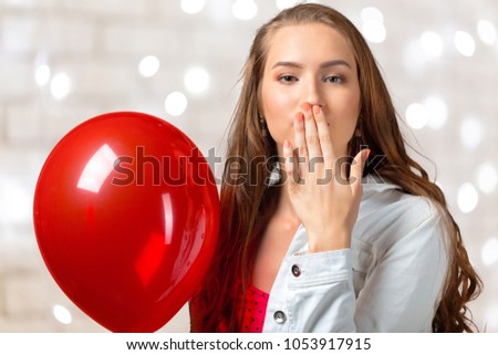 Portrait of joyful woman with balloons
