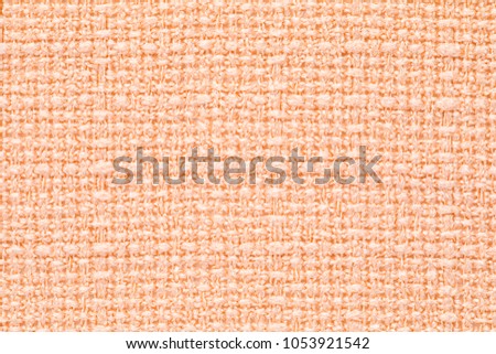 apricot colored fabric texture.