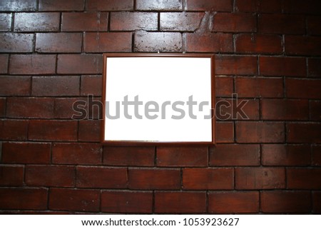 black frame on brick wall