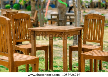
Wooden table, wooden chair on the lawn.