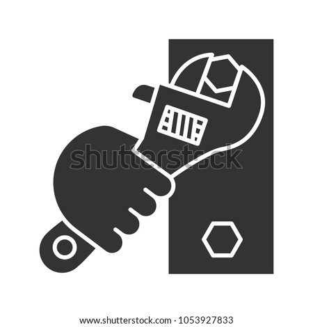 Hand holding wrench glyph icon. Silhouette symbol. Combination spanner turning bolt. Negative space. Vector isolated illustration