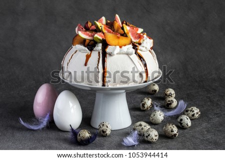 Amazing easter meringue with fresh fruits on grey and easter quail egg