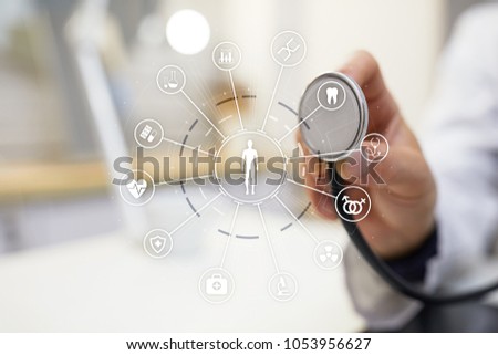 Medicine doctor with modern computer, virtual screen interface and icon medical network connection. Medical technology network and health care concept.