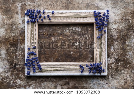 Rustic background with vintage wooden picture frame mock up and copy space.