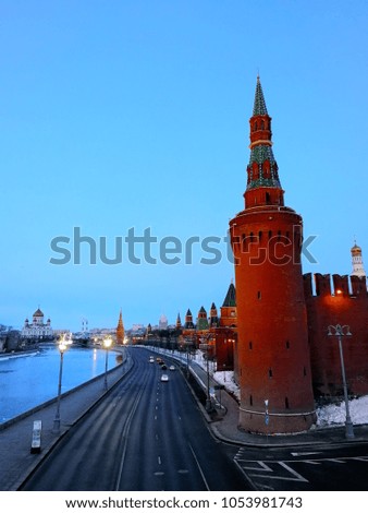 Moscow, Russia. Aerial view of popular landmark - Kremlin, Moscow, Russia during the morning. Few cars at the road, clear blue sky