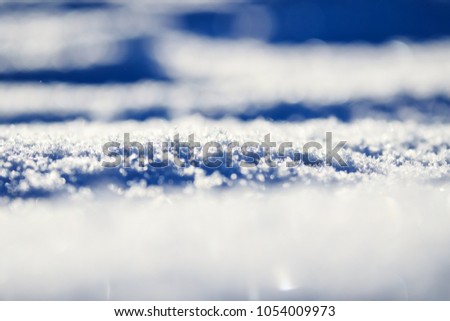 White ice snow winter seasonal texture background like base minimal simple cover floor ground background for art concept, design ideas, modern art view, pastel blue and white colors, curvy lines