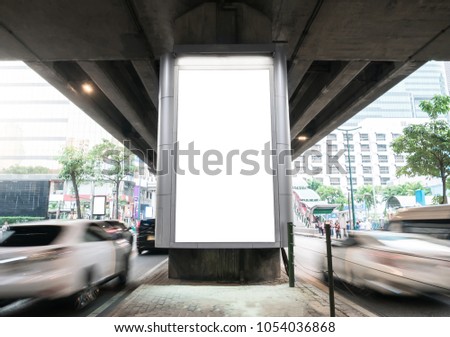 Mock up Billboard Media Light box outdoor street with Road and cars moving Sign display.