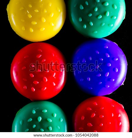 
Macro of colorful, red, yellow, green and purple burgers