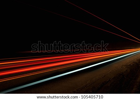 Interesting and abstract lights in a tunnel in orange that can be used as background or texture Royalty-Free Stock Photo #105405710