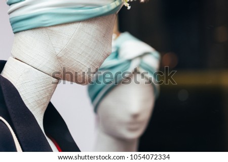 Close-up of a plastic mannequin head beautiful headdress