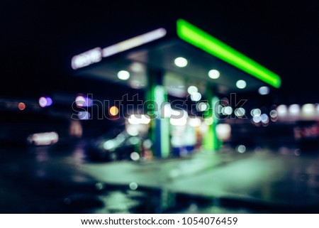 Gas station at night. Bokeh abstract photo of petrol station with cars light defocused