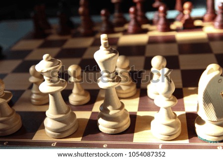 Wooden Chess Pieces on Chess Board