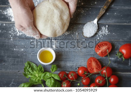 woman preparing pizza dough