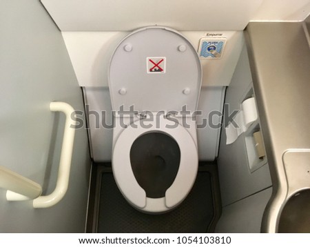Photo of a lavatory in a commercial airplane.
