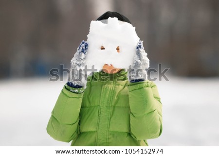 a boy wearing a snow mask
