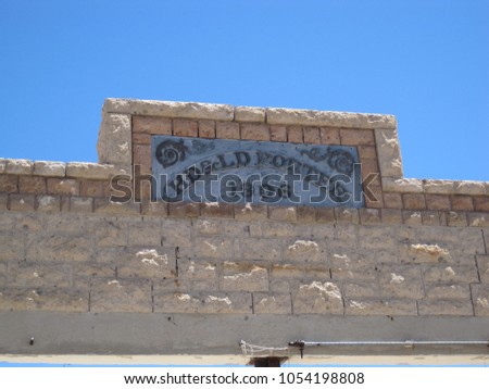 Old sign on abandoned building in a desert ghost sign (Beatty, Nevada)