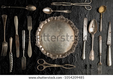 Vintage kitchen utensils on a background, fork, kifes, spoons 