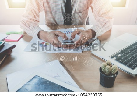 Businessman hand using smart phone,laptop, online banking payment communication network with virtual graphic icon diagram.Close up