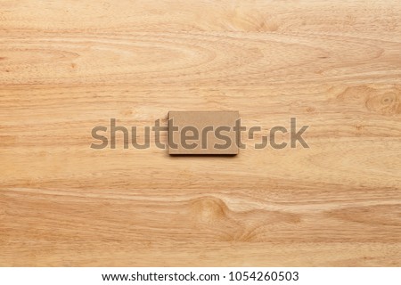 Blank business cards on wooden background. Top view. Brown paper card for  business