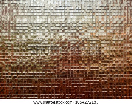 Reflective brown tile background.