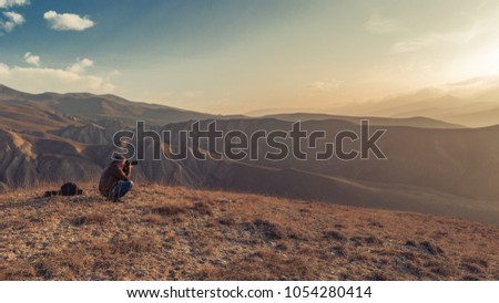 Nature photographer in mountains
