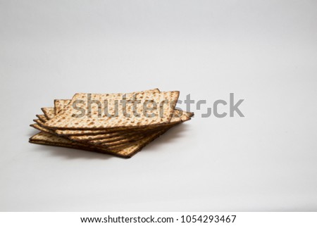 Matzah or matzo, unleavened bread for Pesach, Jewish holiday of Passover, isolated on white background, design element