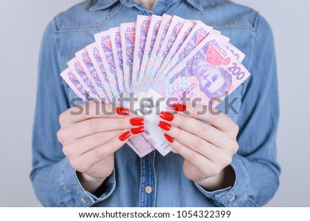 Give bill tax credit interest pawnshop broker investor investment people person debt economy concept. Cropped close up photo of lady's hands with red manicure nails holding money isolated  background