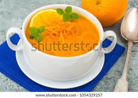 Dietary pumpkin, carrot soup puree with orange. Studio Photo

